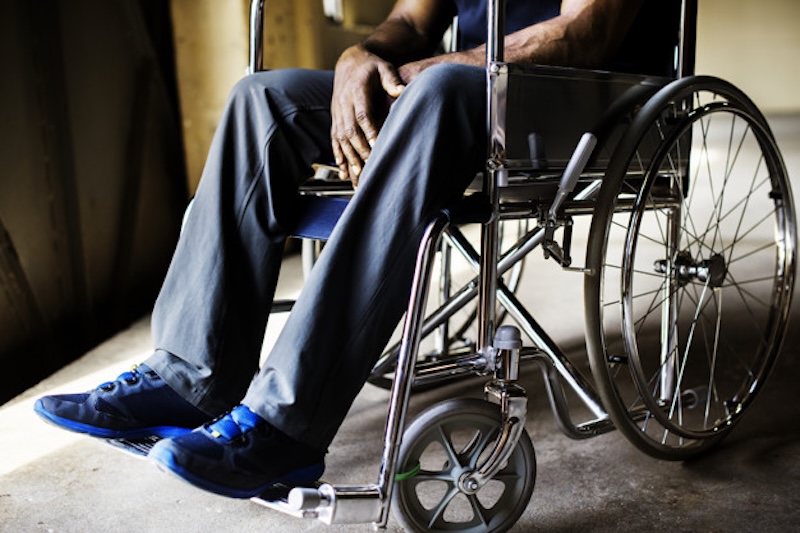 Disabled african man sitting on the wheelchair